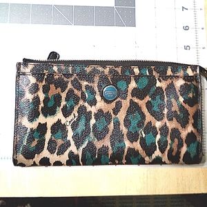 Coach ocelot wallet w/inside issues. Some crackling on strap  See internal peel